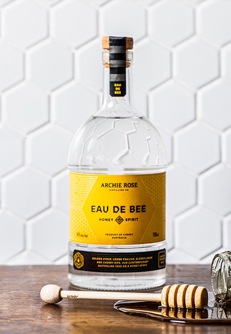archie-rose-eau-de-bee-honey-spirit-bottle-with-jars-of-honey