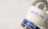 Thumbnail for overhead-shot-of-archie-rose-bone-dry-gin-white-label-closeup