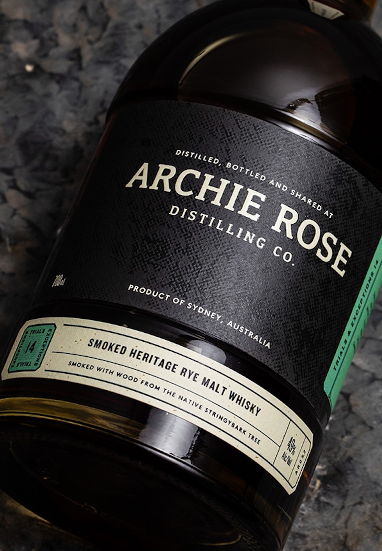 Overhead-view-of-front-of-Archie-Rose-Smoked-Heritage-Rye-Malt-Whisky-bottle