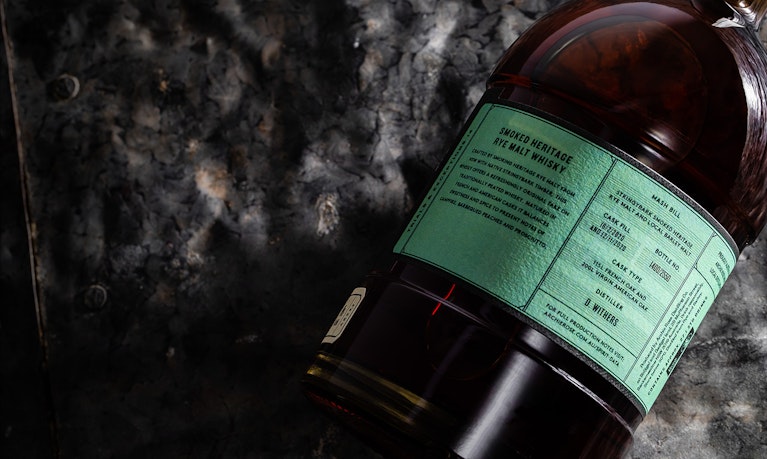Overhead-view-of-back-of-Archie-Rose-Smoked-Heritage-Rye-Malt-Whisky-bottle