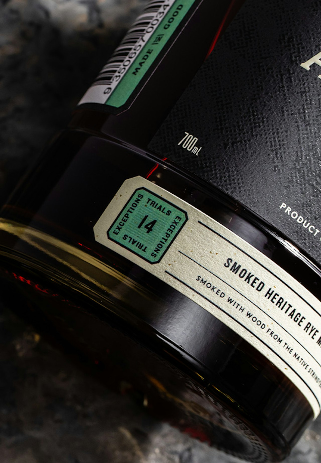 Overhead-view-of-Archie-Rose-Smoked-Heritage-Rye-Malt-Whisky-bottle-base-label