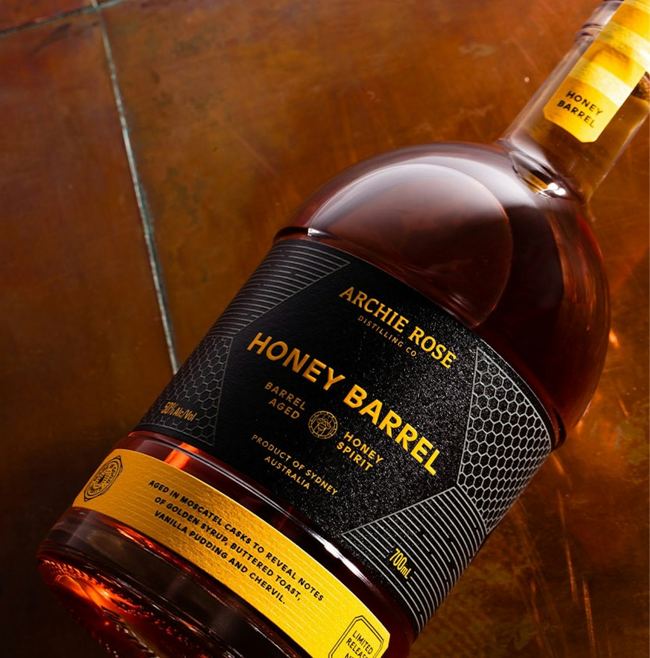archie-rose-honey-barrel-barrel-aged-honey-spirit-overhead-shot-front-of-bottle