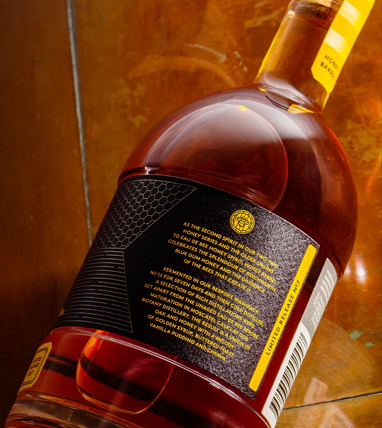 archie-rose-honey-barrel-aged-spirit-overhead-shot-back-label