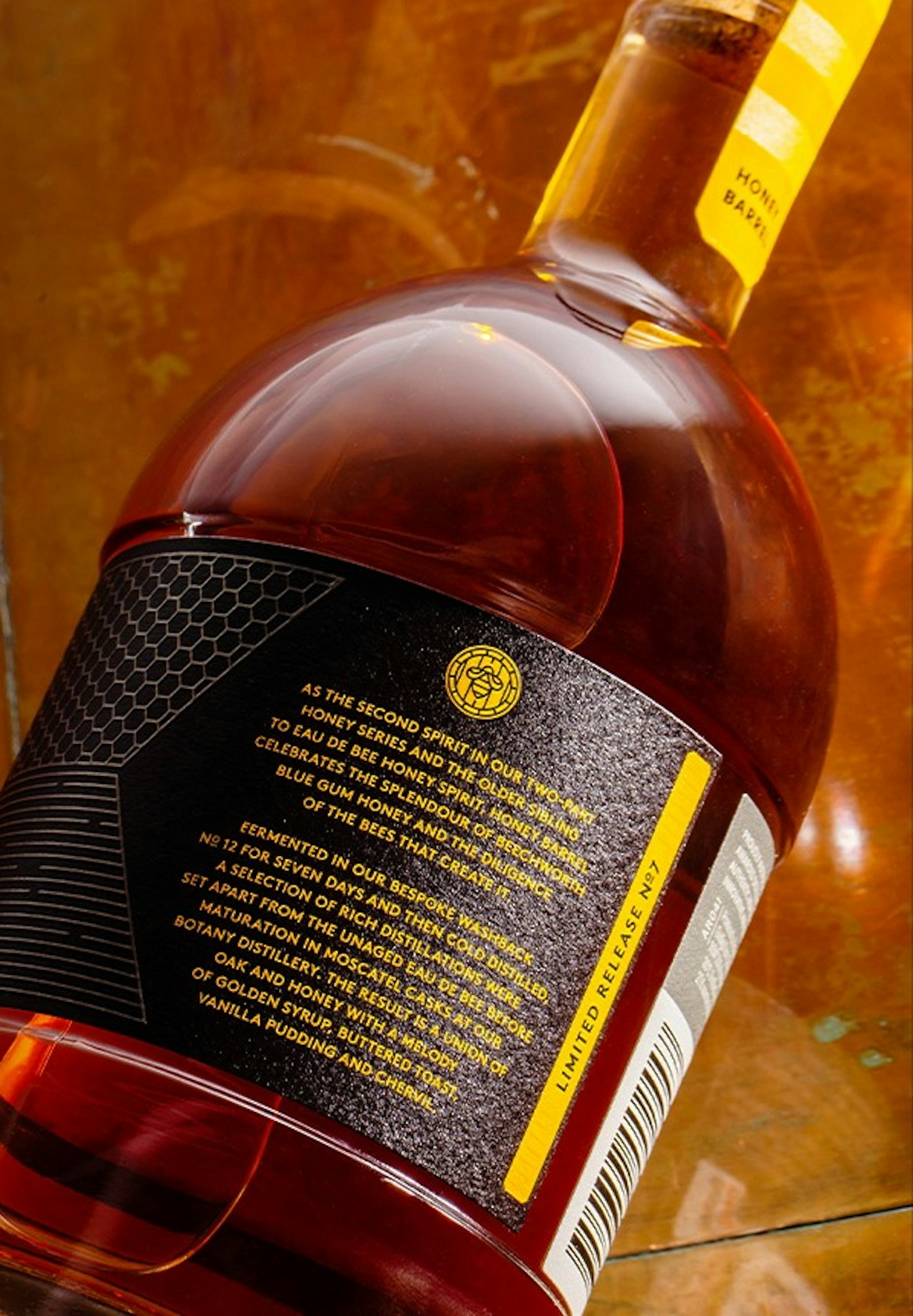 archie-rose-honey-barrel-aged-spirit-overhead-shot-back-label