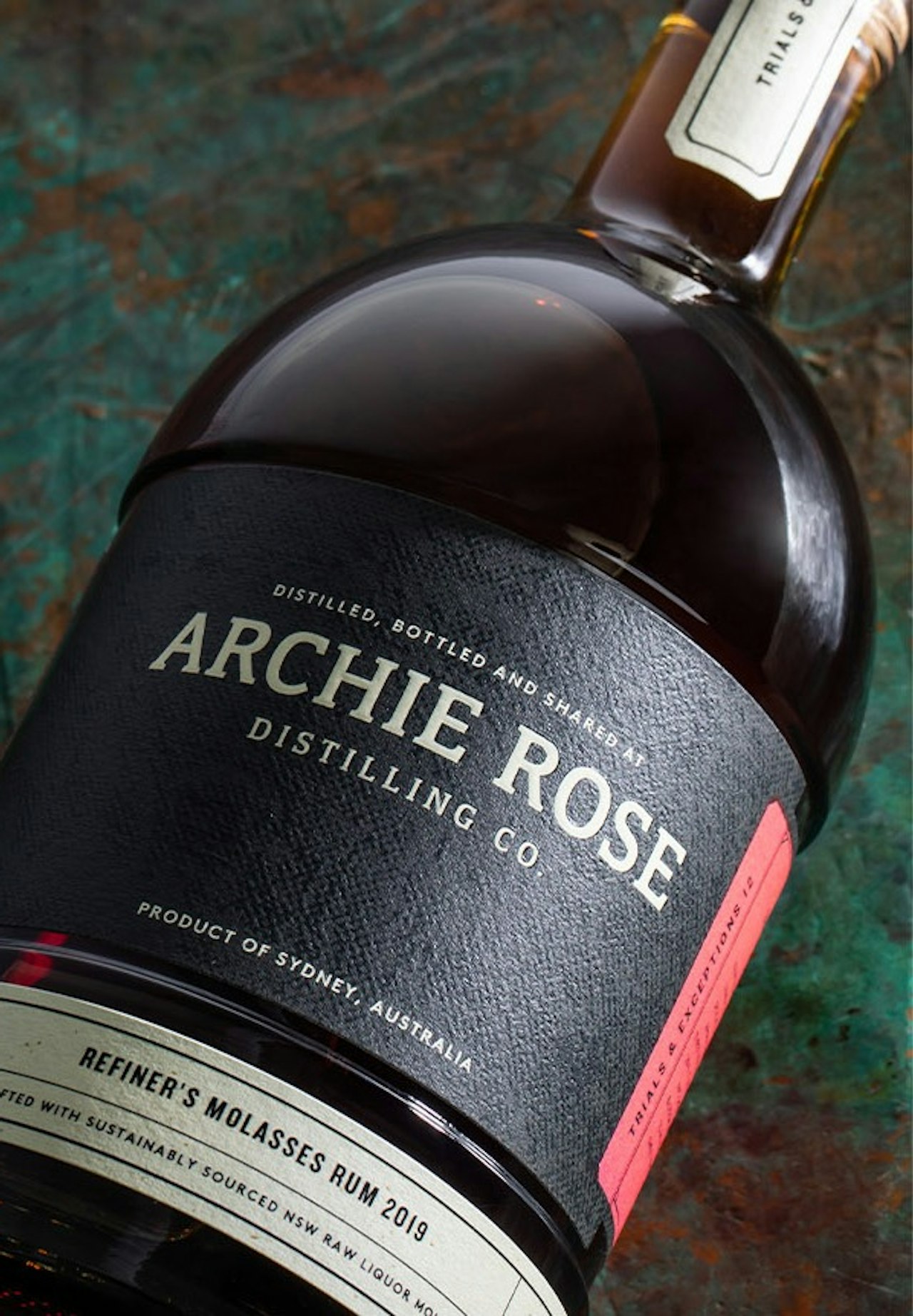 archie-rose-refiners-molasses-rum-overhead-shot-label-front-closeup