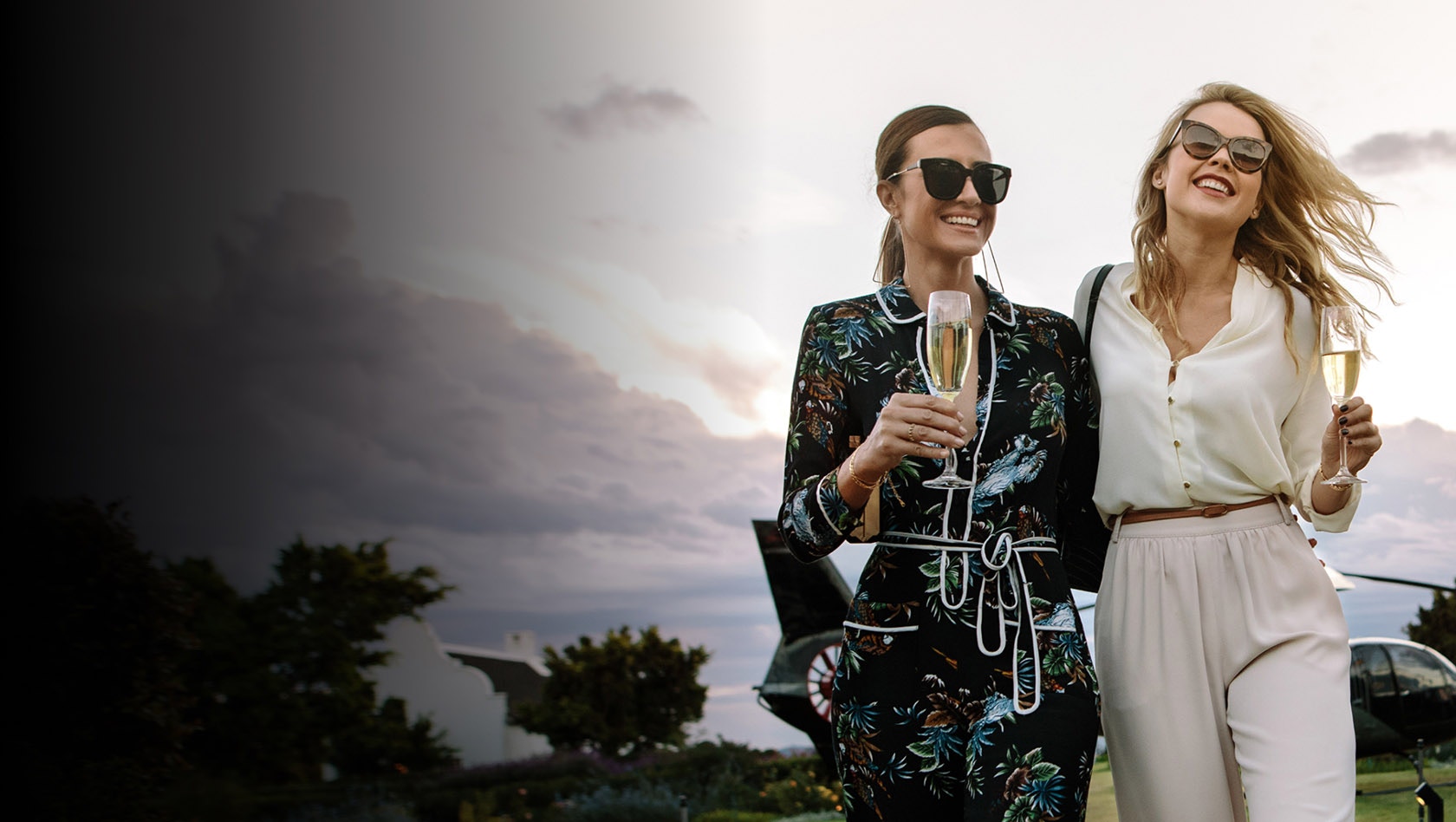 Two women walking together smiling