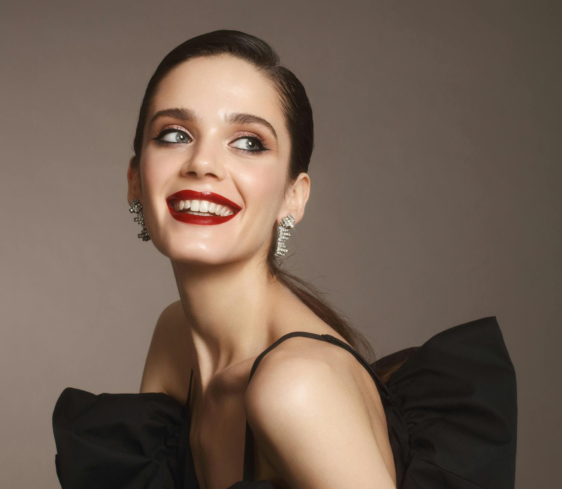 Woman wearing a black dress smiling