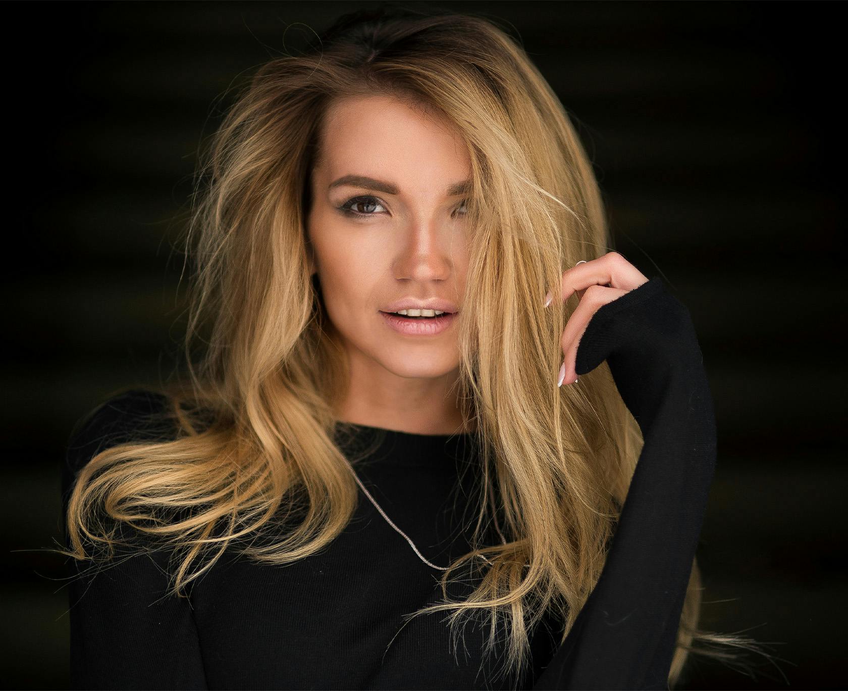 Woman in a black long sleeve top