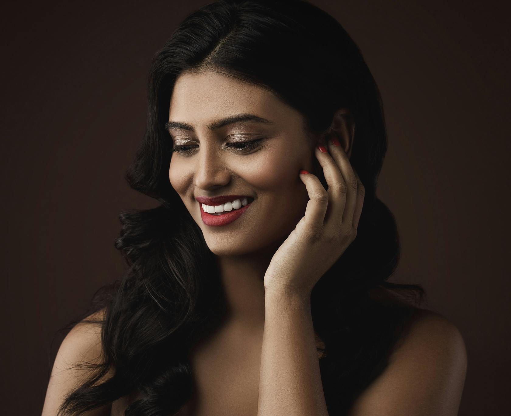 Woman with dark hair smiling