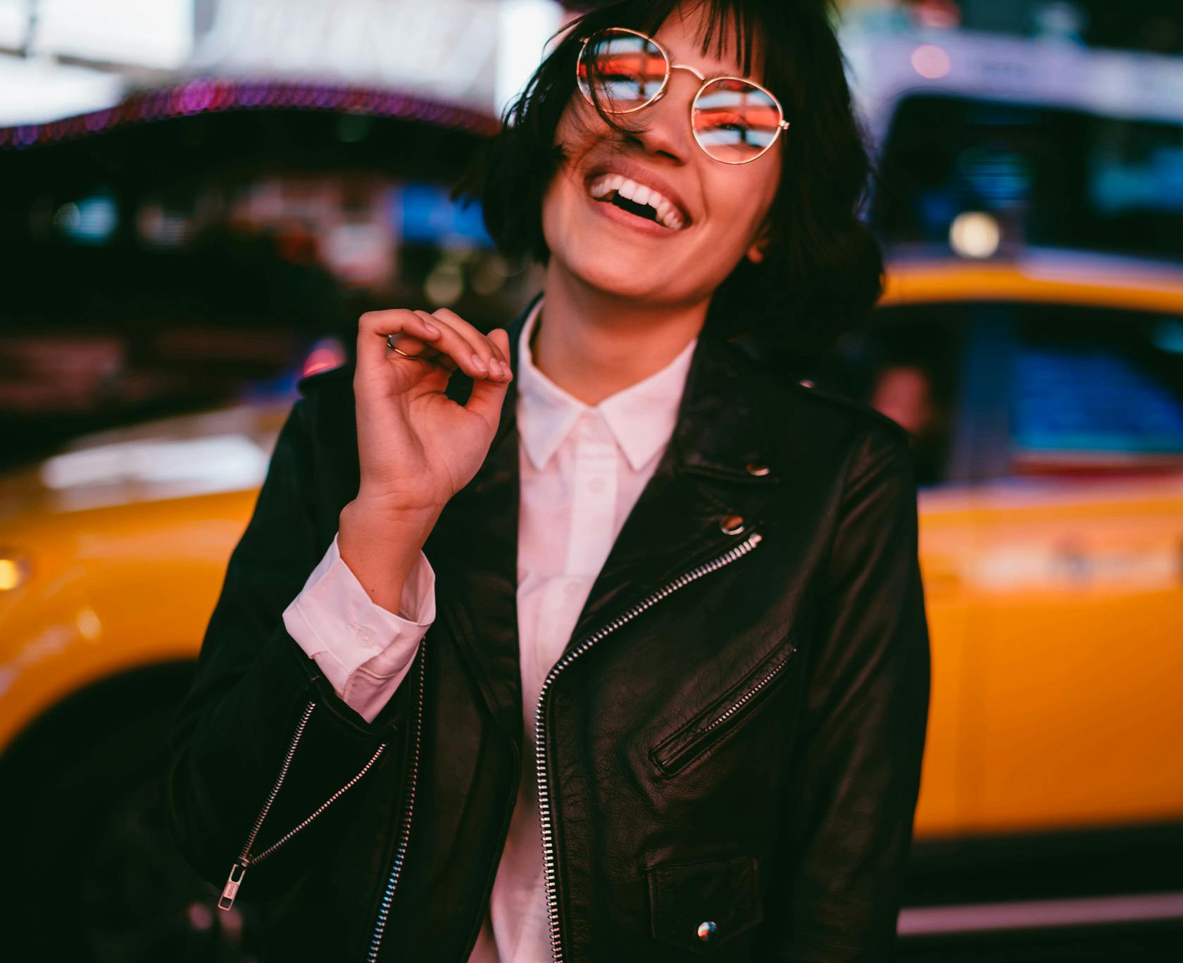 Woman with a bob standing outside