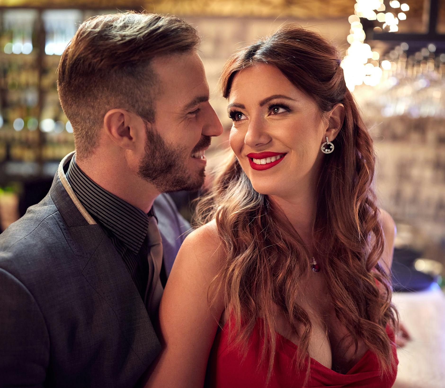 Man and woman standing together at a restaurant