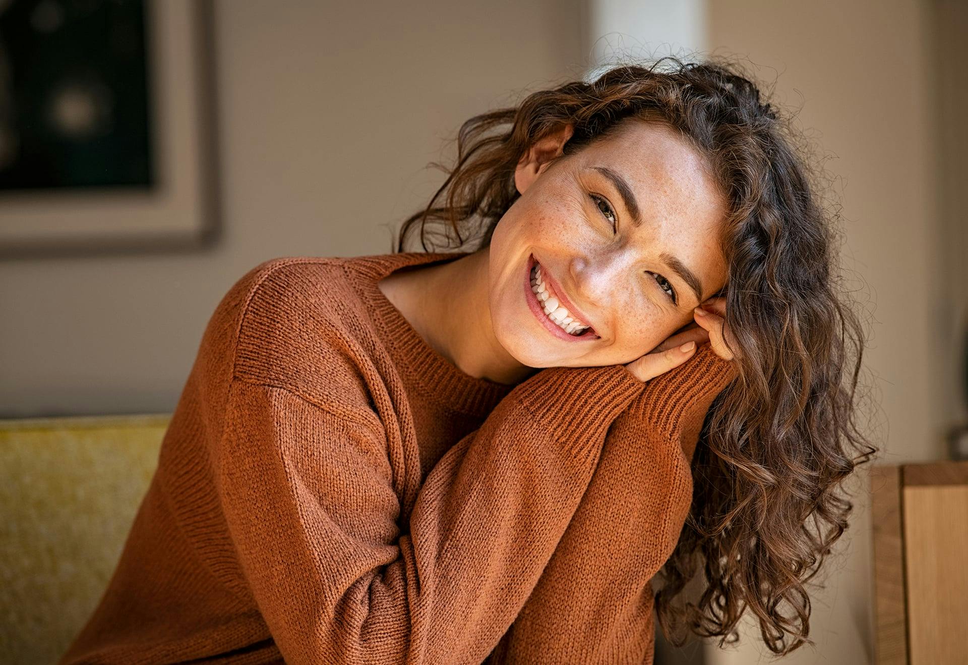 Woman smiling with clear skin after acne treatment in Tampa