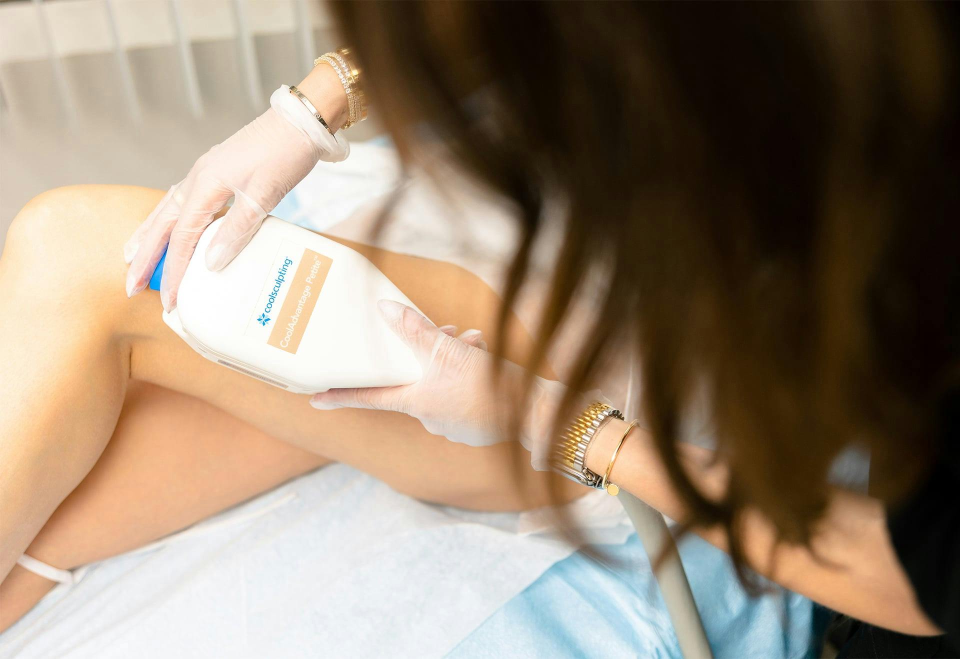 Nurse adminstering treatment to a patient's leg