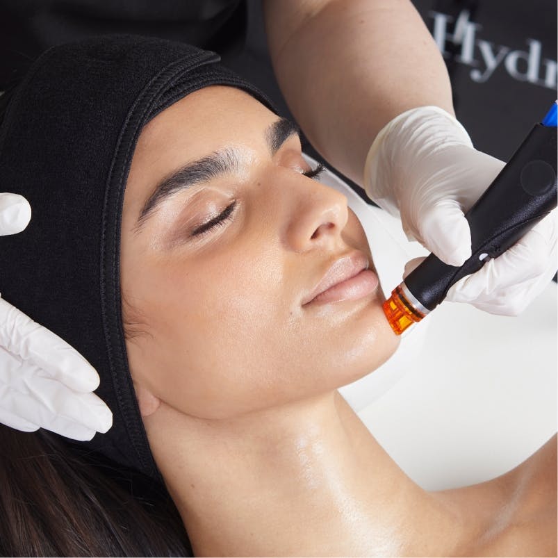 A woman getting a HydraFacial in Tampa.