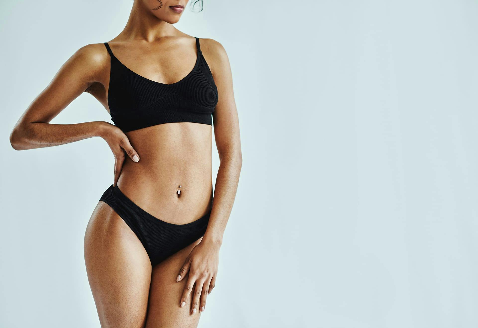 Woman in black underwear posing