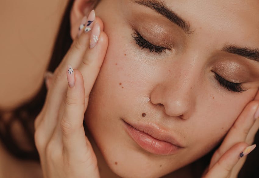 Woman with her hands on her face
