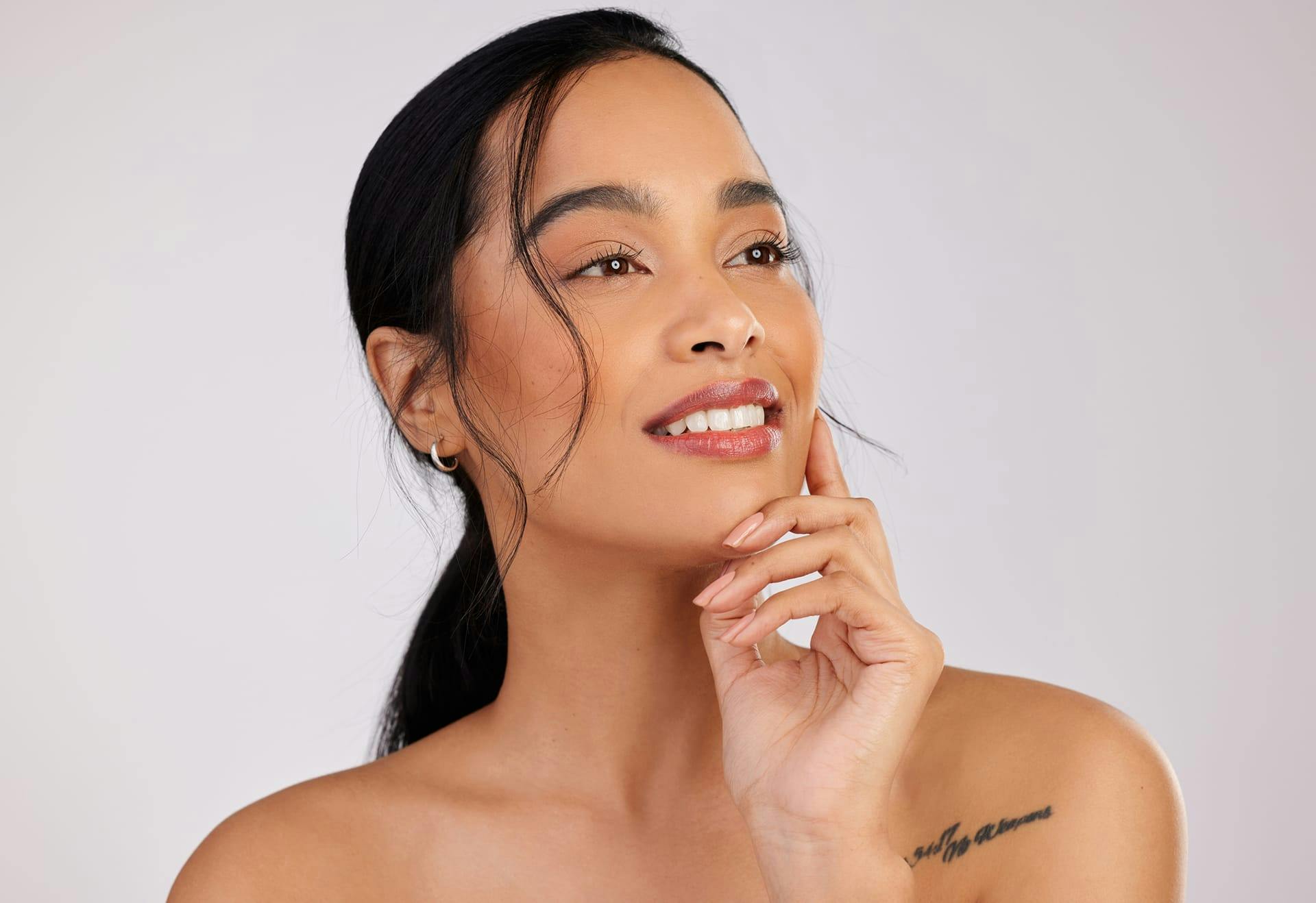 Woman with her hand on her chin