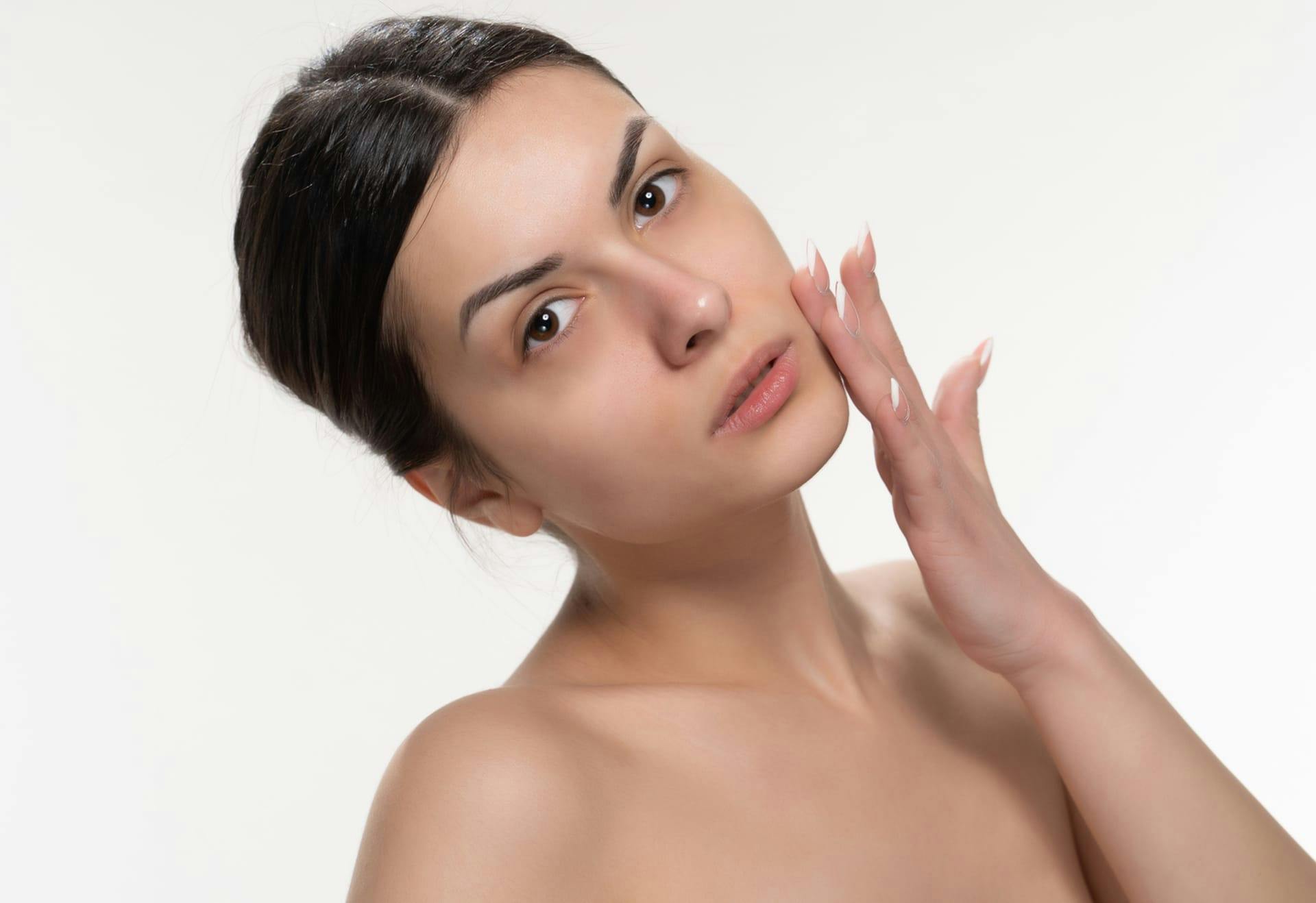 Woman with her hand on her cheek