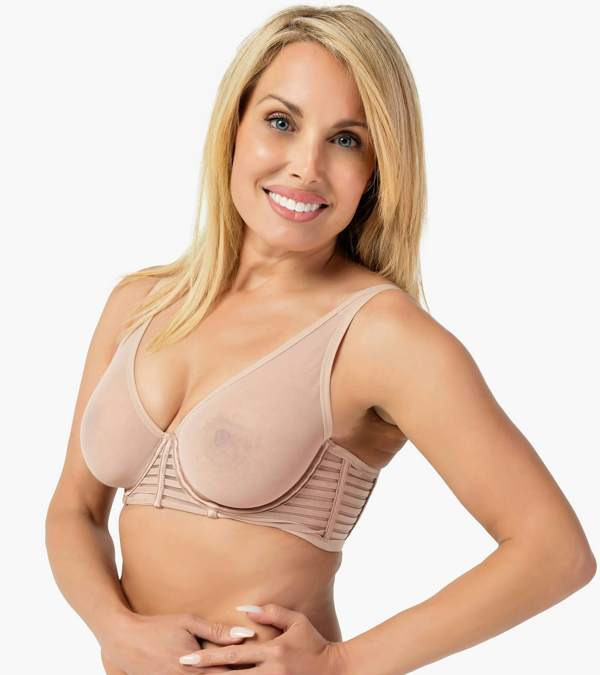 woman in a nude colored bra posing for a picture