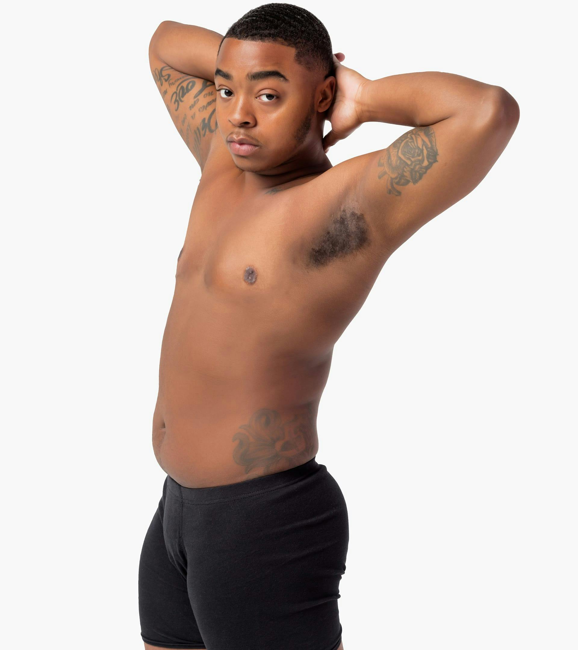 Person posing with their hands on their head