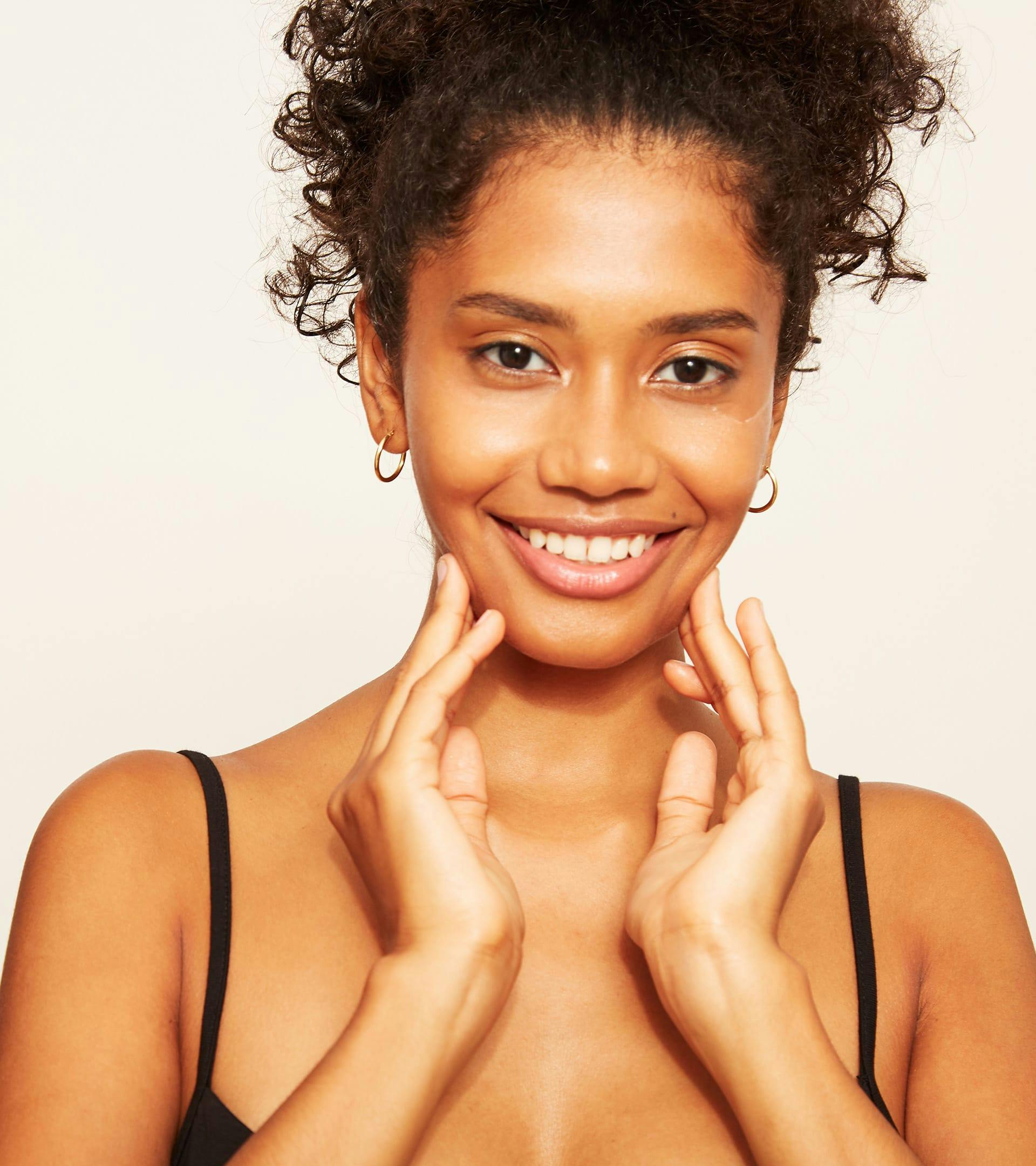 there is a woman with a black tank top posing for a picture