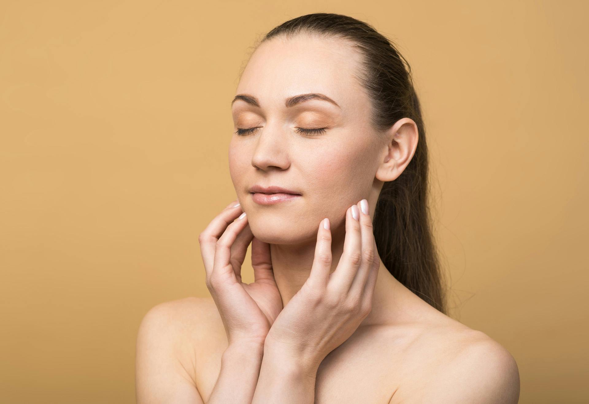 Woman with her hands on her cheeks