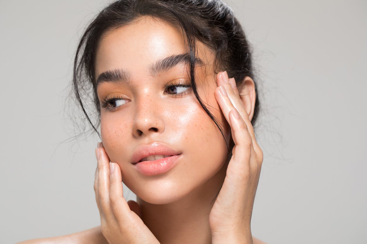 Woman holding her cheeks