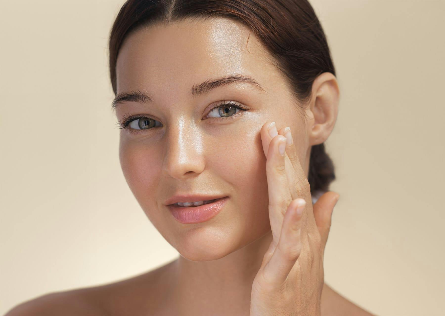 Woman running hand over smooth cheek