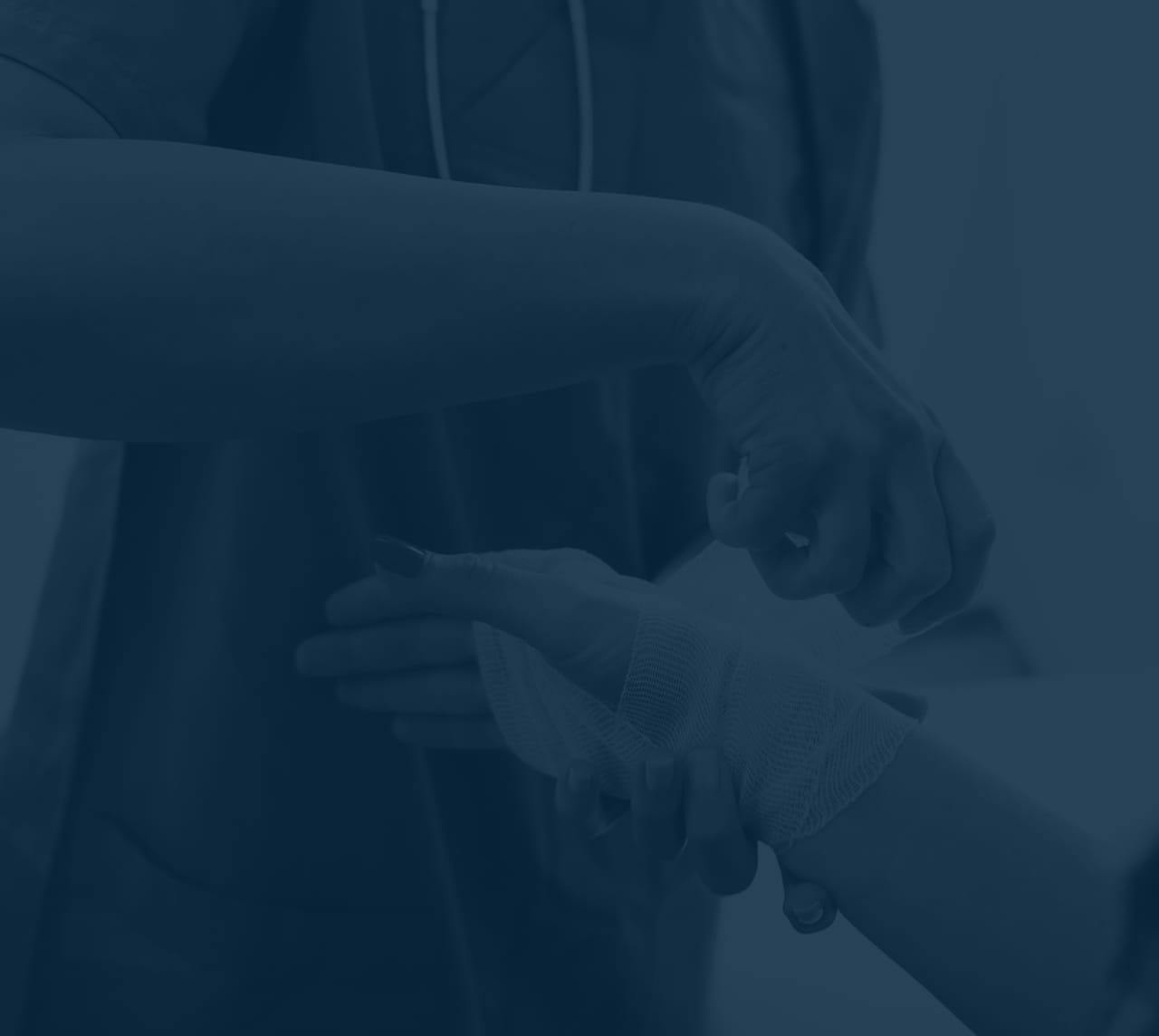 Blue-filtered image of person getting bandaged