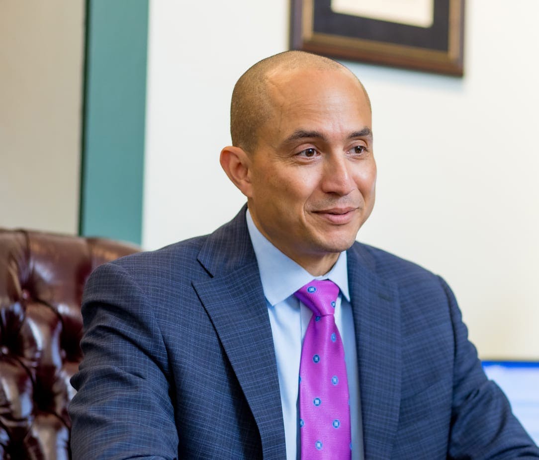 Attorney Rick Rivera, seated