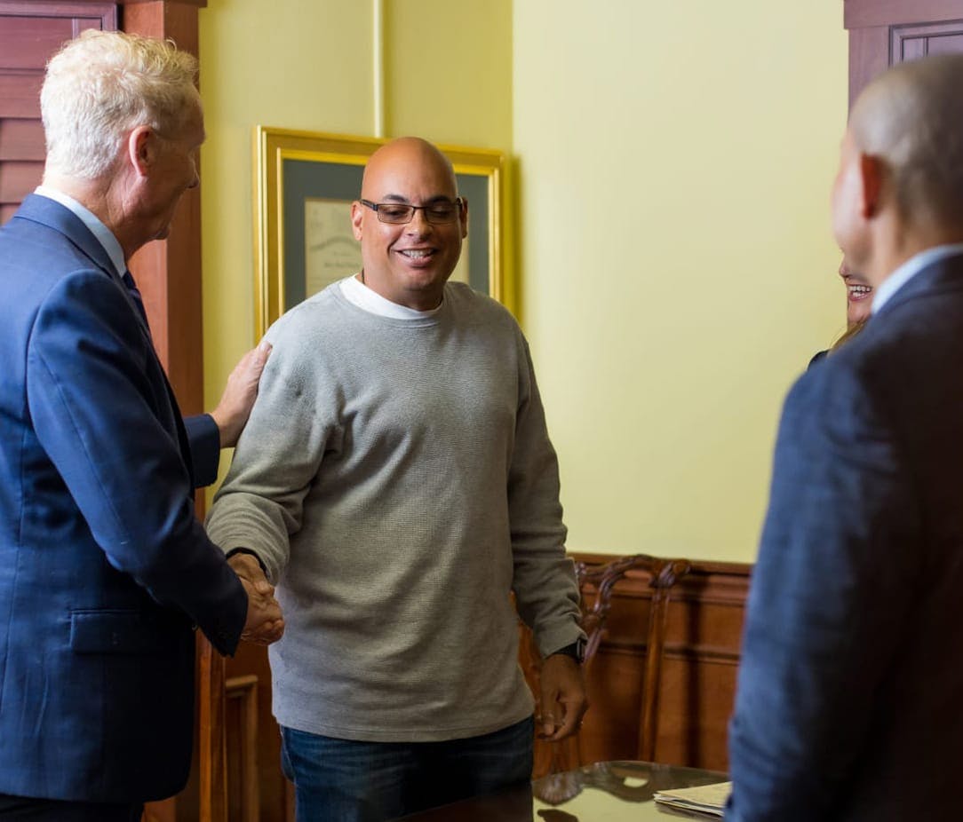 Attorneys meeting with a client