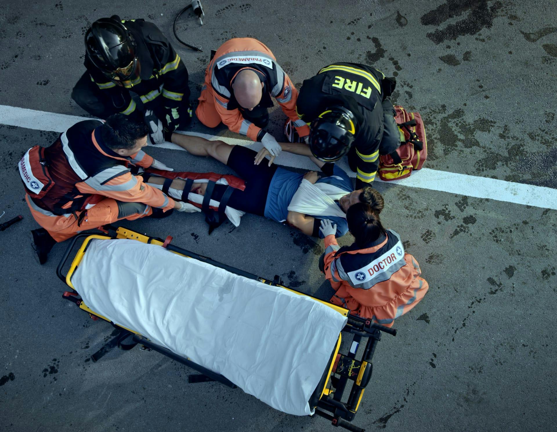 Parametics attending injured person