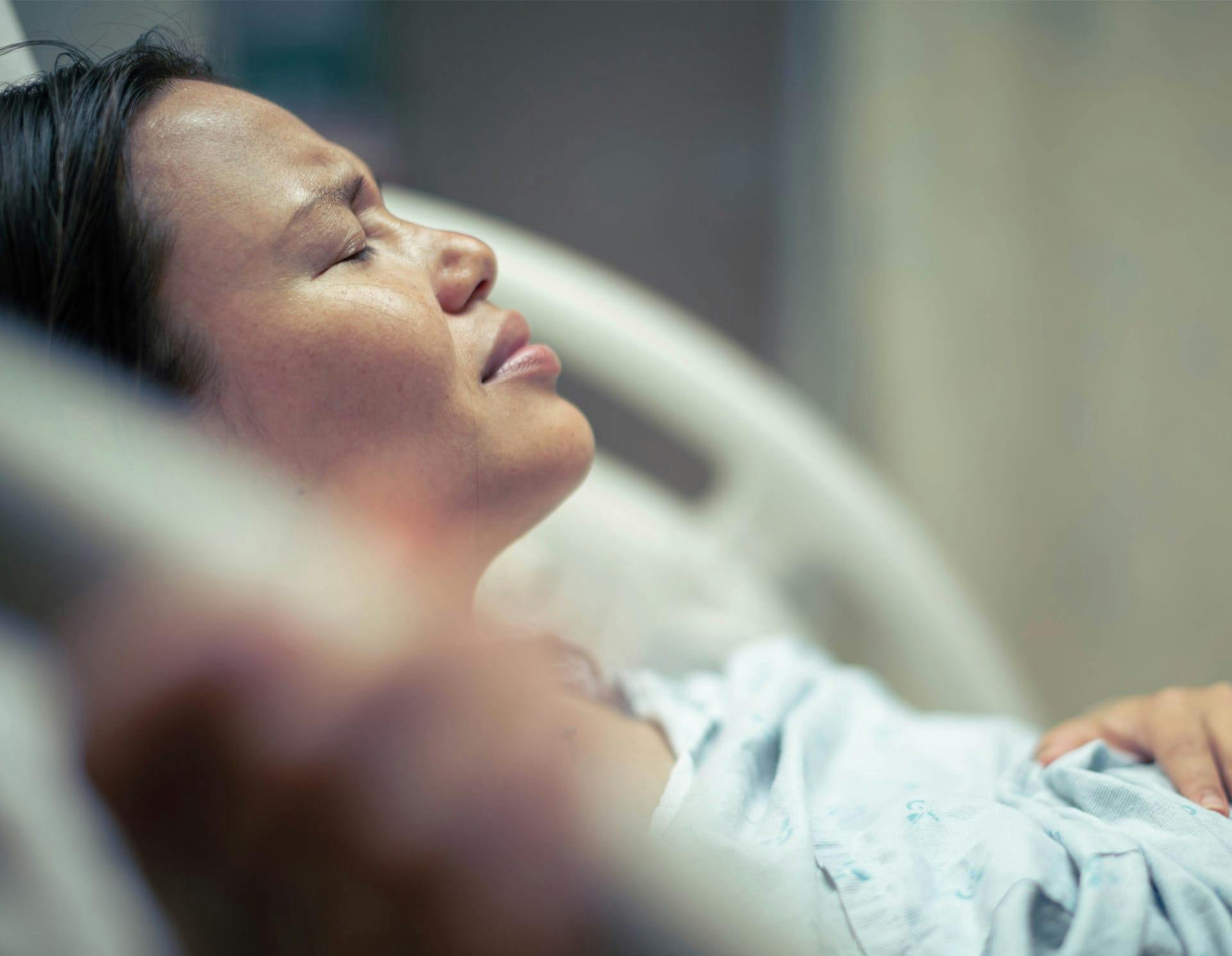 Woman in hospital bed