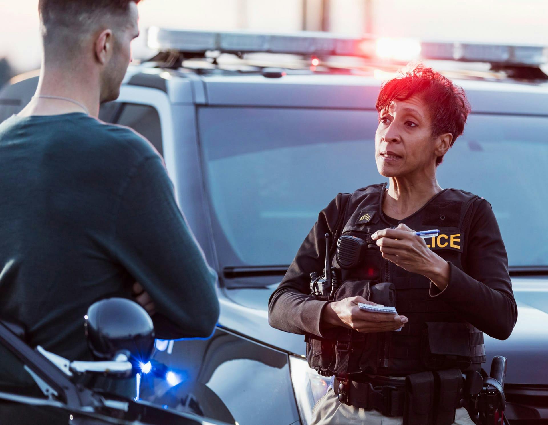 Police Officer talking to man