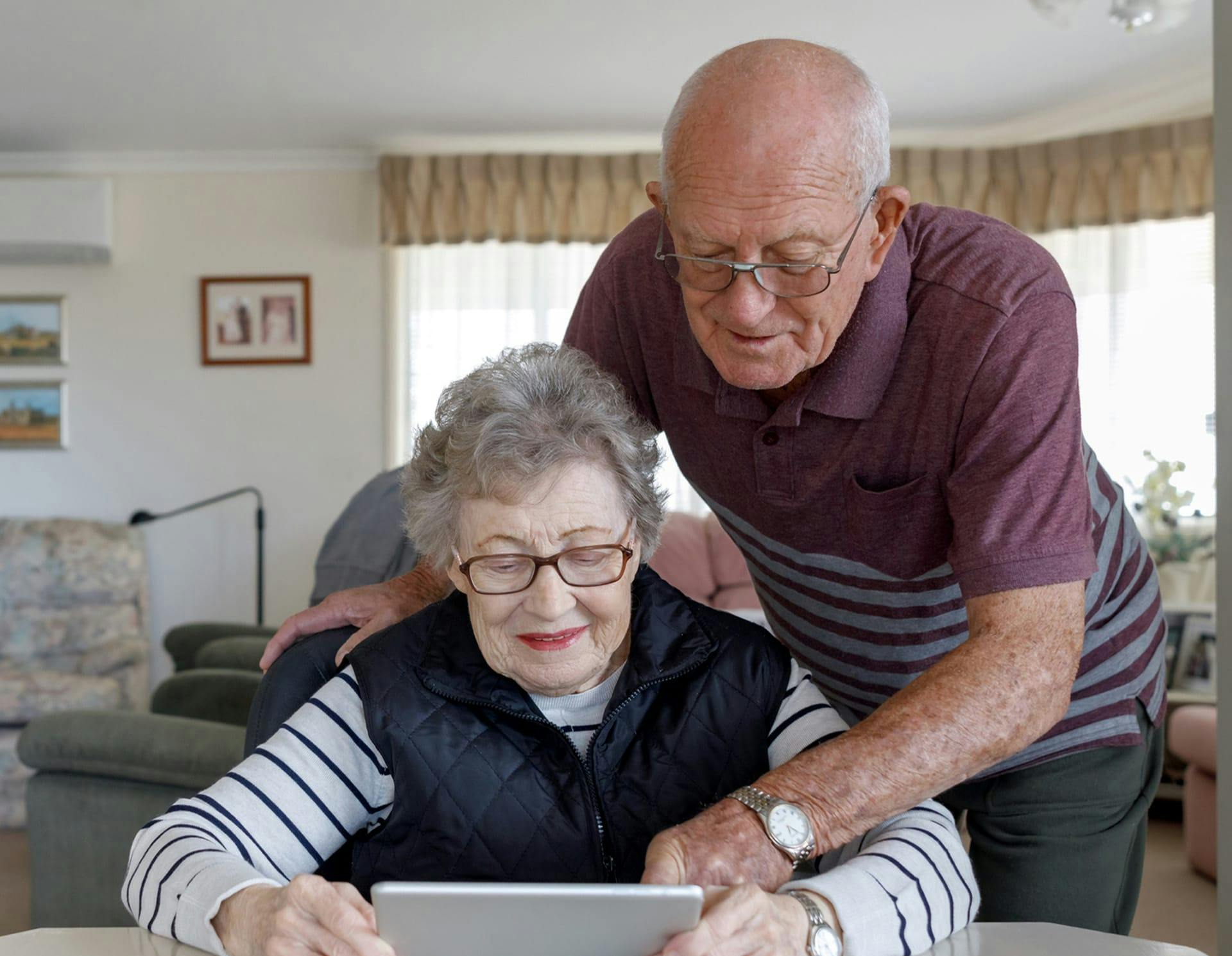 Older couple looking at tablet
