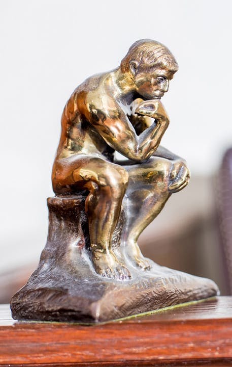 Thinking man statuette