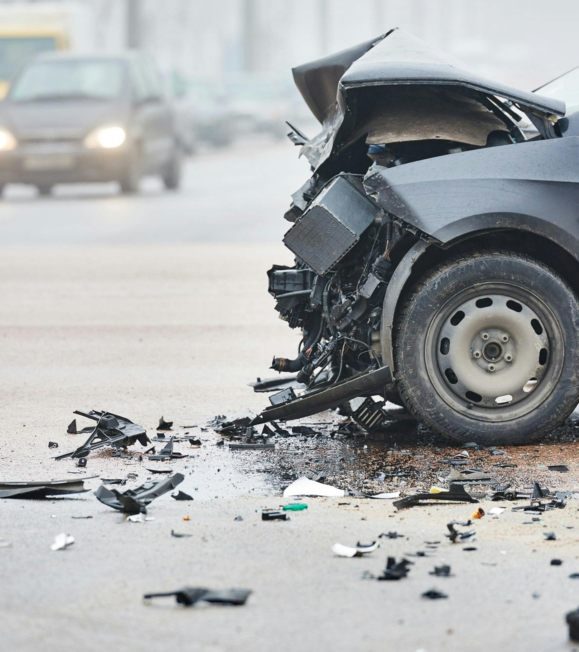 Busted up vehicle from a car accident.
