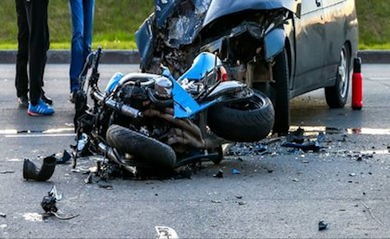 Photo of a very wrecked motorcycle.
