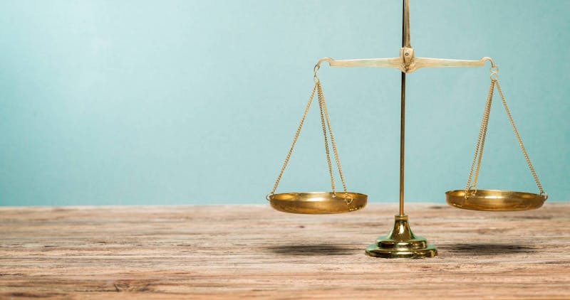 Closeup of the scales of justice.