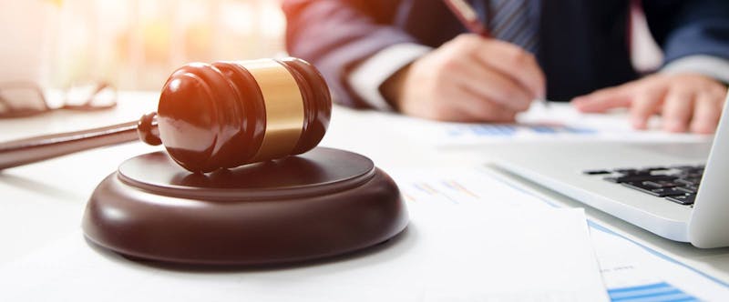 Attorney at desk with gavel