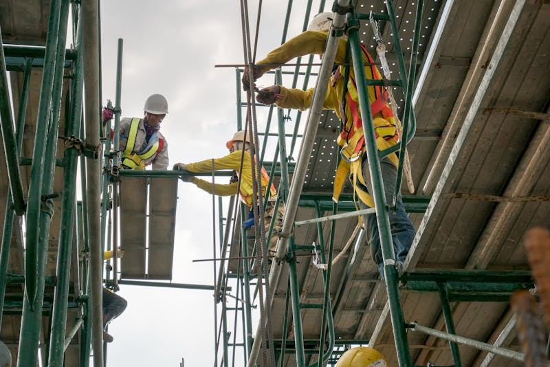 Man standing on scaffolding.