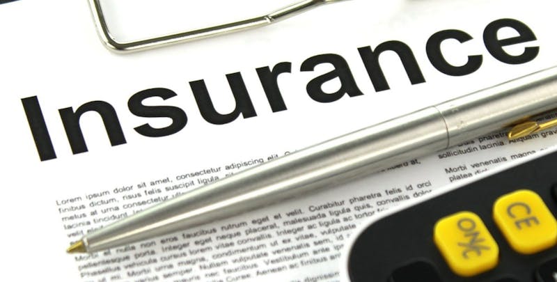 Closeup of a paper that says Insurance on top.