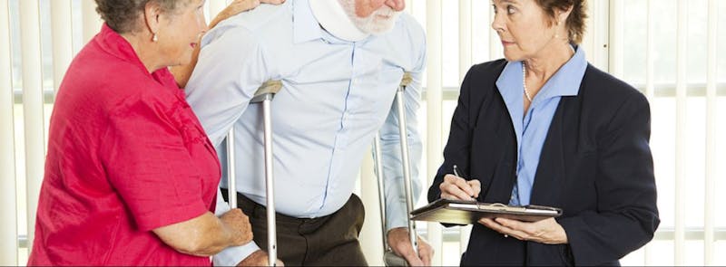 Man walking with crutches.