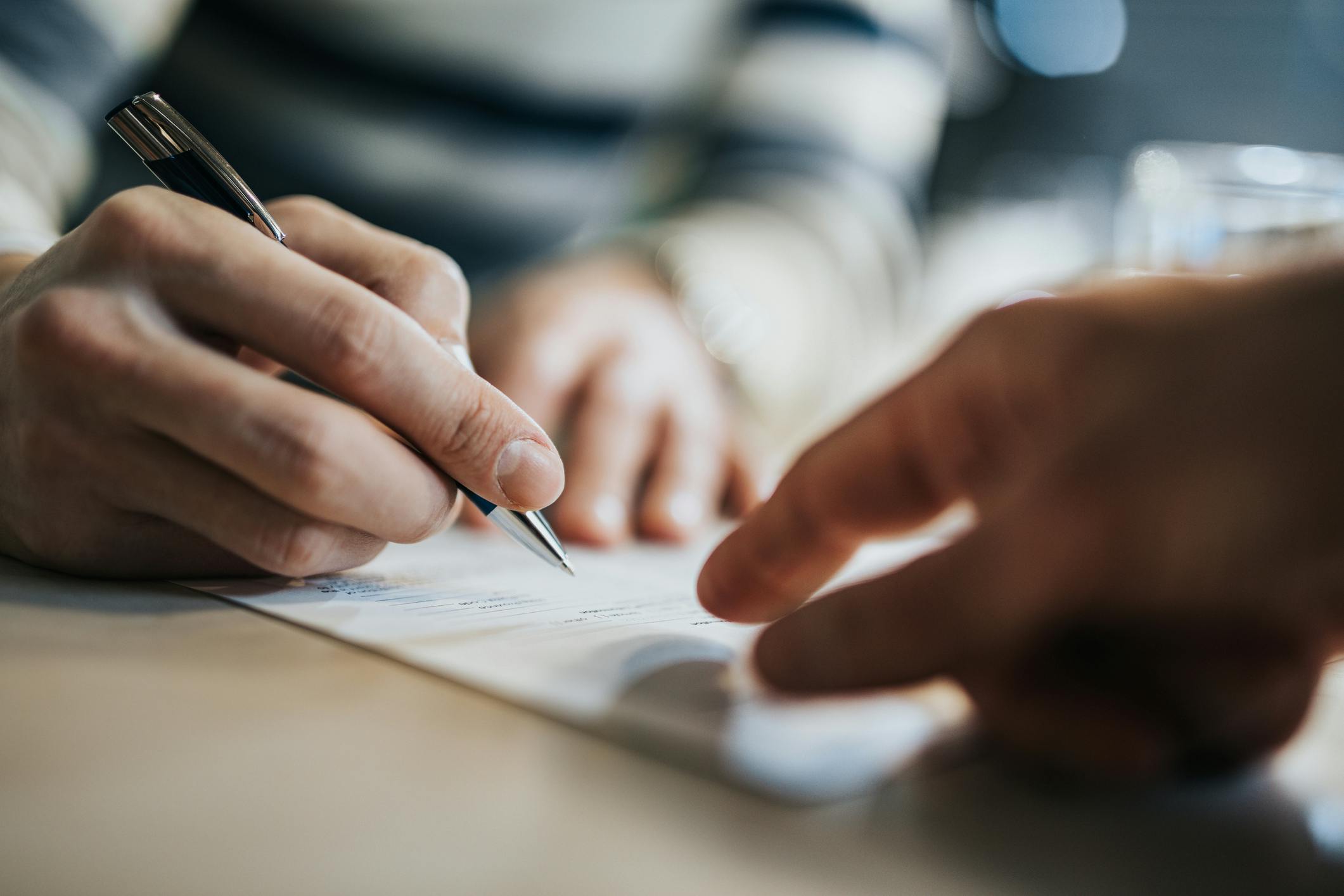 Person writing on paper