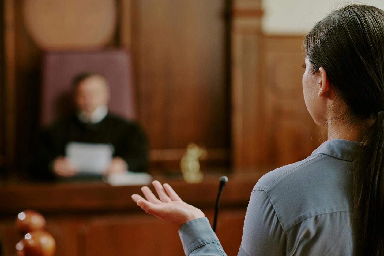 woman talking to a judge in court