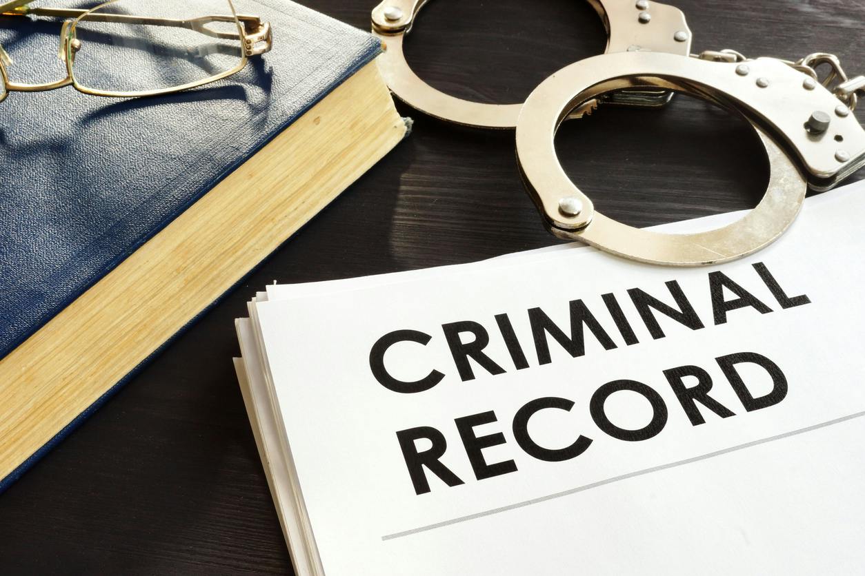 criminal records and handcuffs