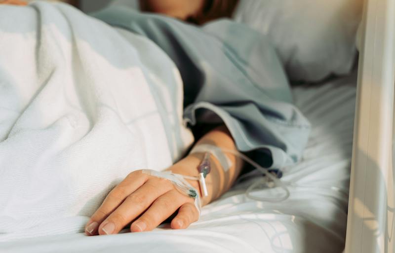 A woman laying in a hospital bed