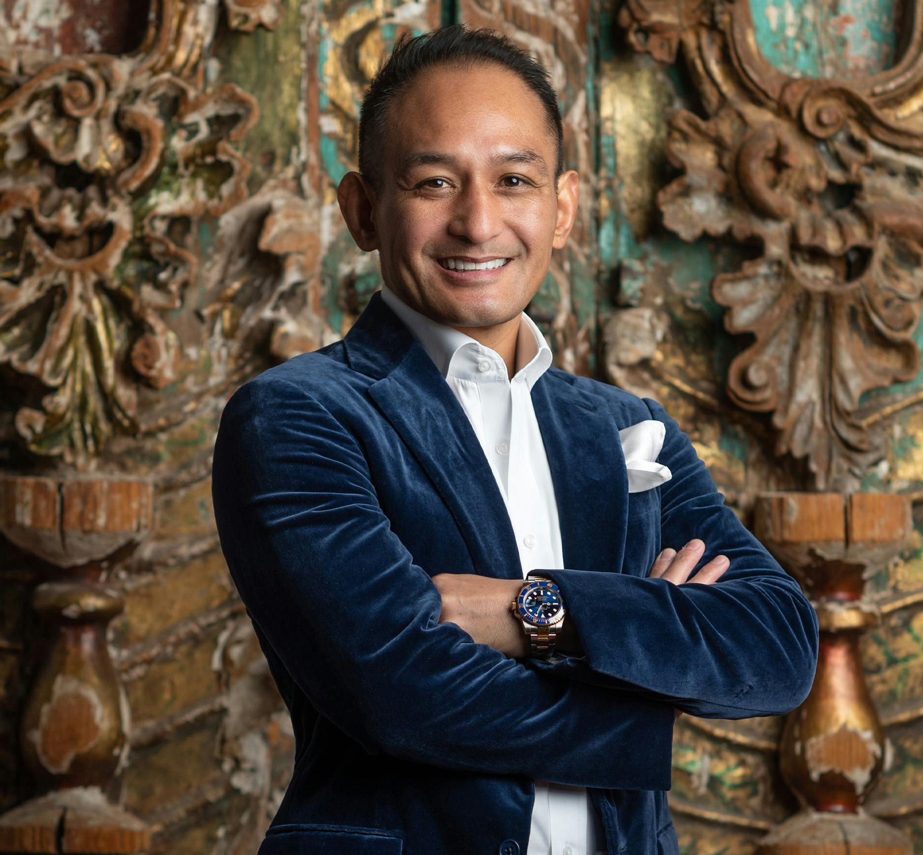 Dr. Andres standing with arms crossed