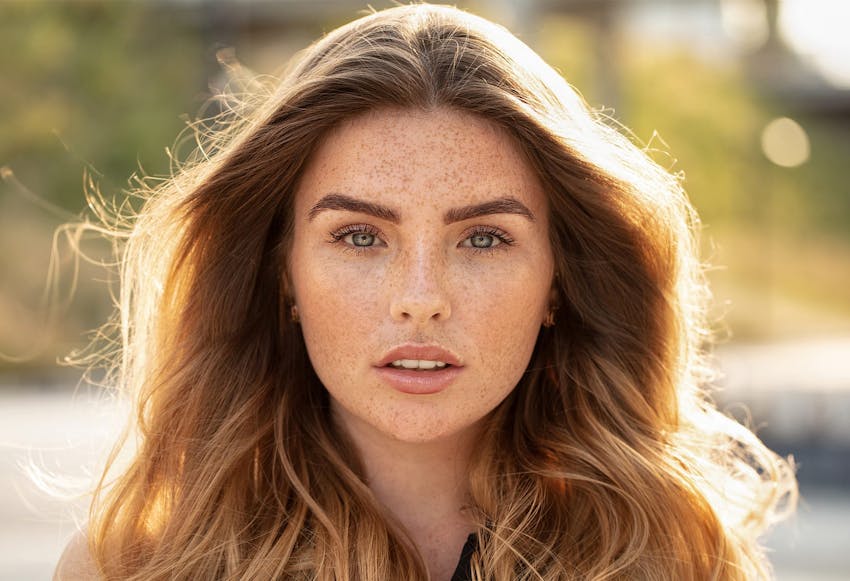 Woman with red hair and freckles